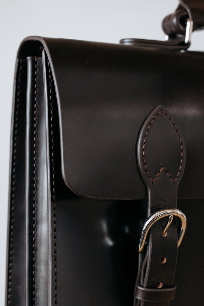 services-01 Close-up of a classic leather briefcase showcasing detailed craftsmanship and luxury finish.